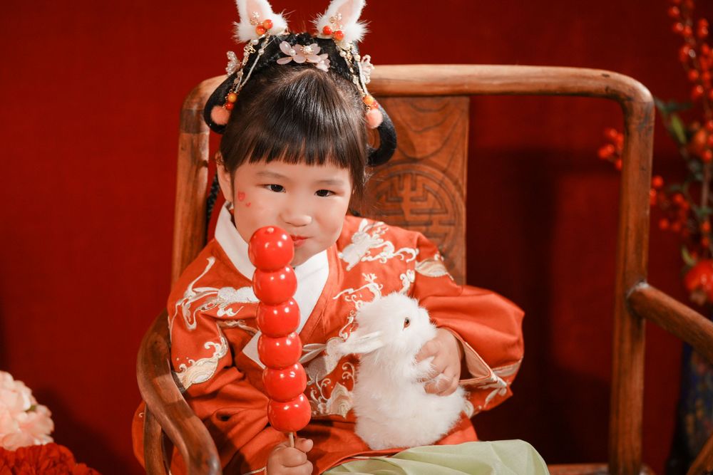 Cute solo children's photography in an elegant Ming Dynasty Hanfu, beautifully shot in studio by Imagine Image Studio.
