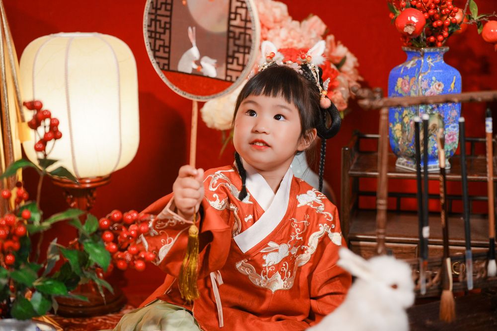 Cute solo children's photography in an elegant Ming Dynasty Hanfu, beautifully shot in studio by Imagine Image Studio.