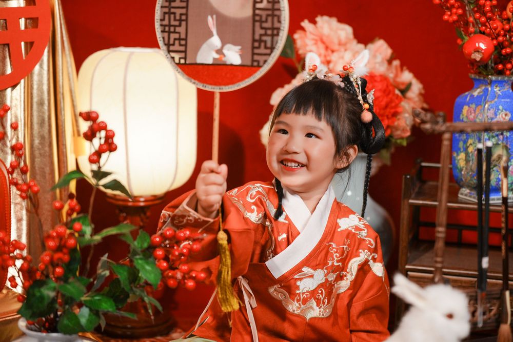 Cute solo children's photography in an elegant Ming Dynasty Hanfu, beautifully shot in studio by Imagine Image Studio.