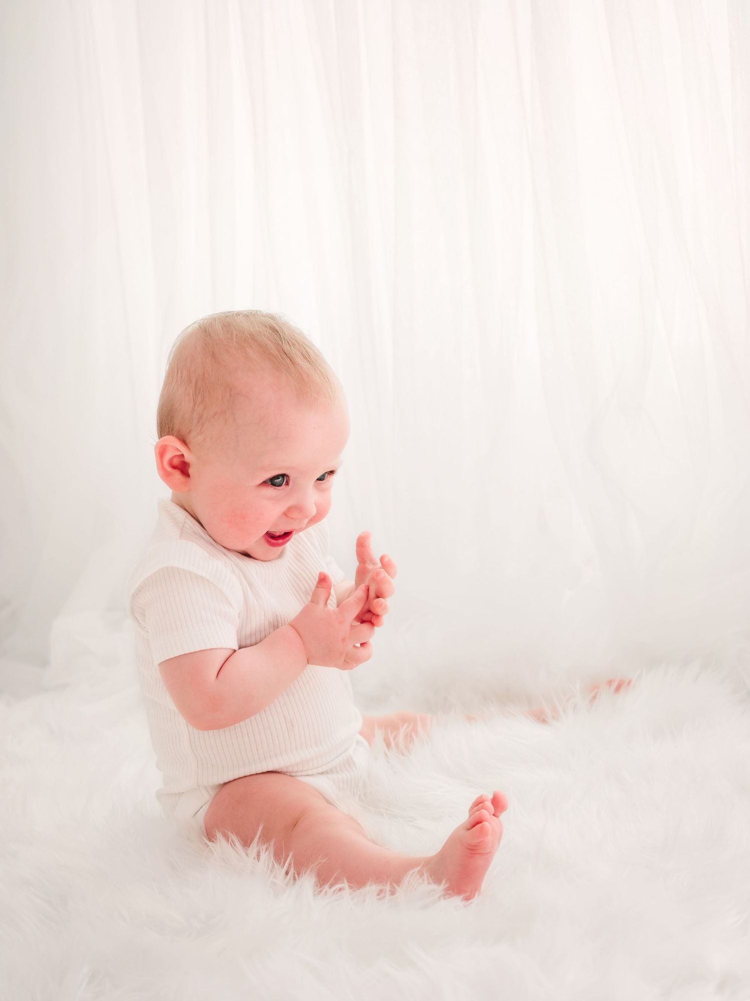 product photo of a display box holding printed photos from a newborn photo session