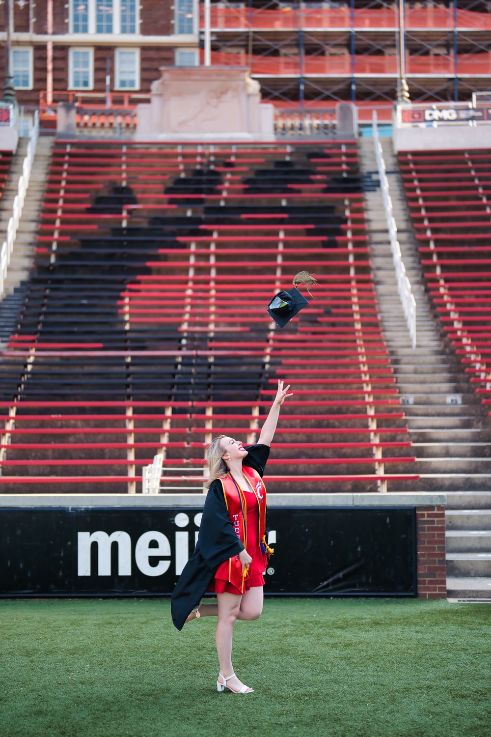 Morgan getting her senior portraits done at the University of Cincinnati downtown at the Bearcat's stadium for graduation : Senior Portrait