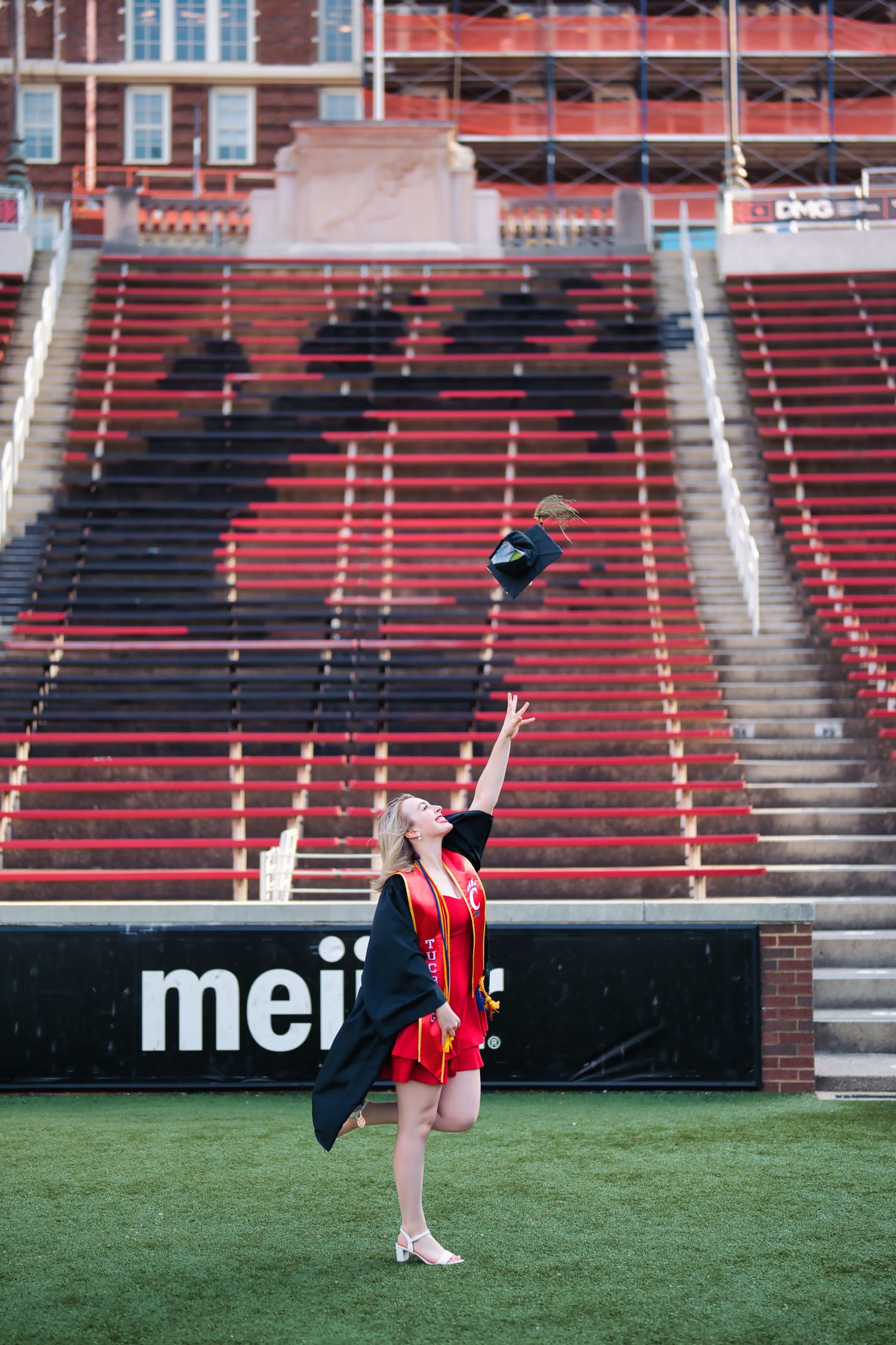 Morgan getting her senior portraits done at the University of Cincinnati downtown at the Bearcat's stadium for graduation : Senior Portrait