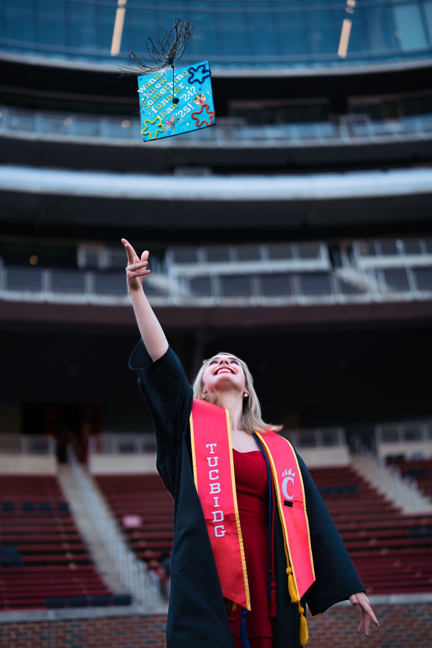 Morgan getting her senior portraits done at the University of Cincinnati downtown at the Bearcat's stadium for graduation : Senior Portrait