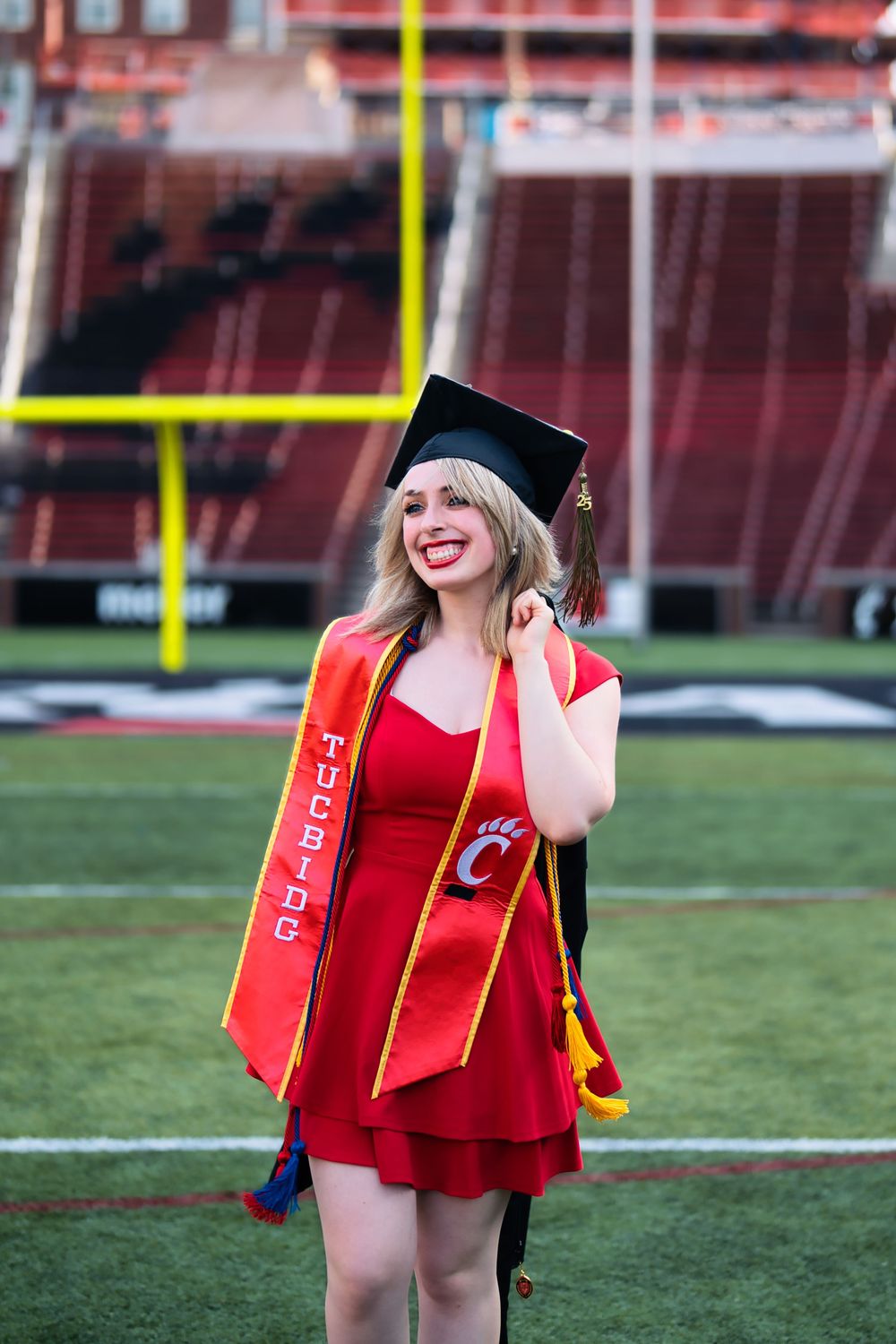 Morgan getting her senior portraits done at the University of Cincinnati downtown at the Bearcat's stadium for graduation : Senior Portrait