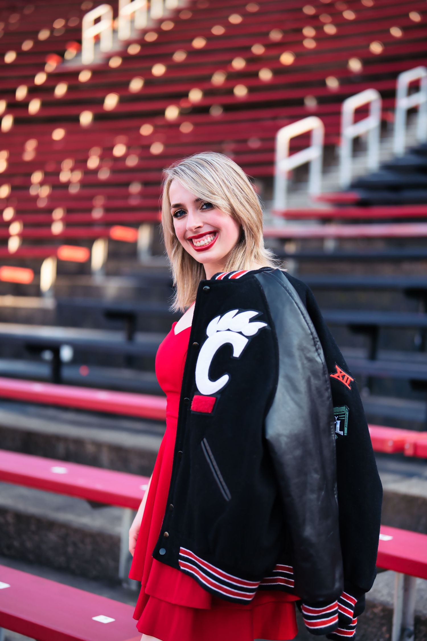 Morgan getting her senior portraits done at the University of Cincinnati downtown at the Bearcat's stadium for graduation : Senior Portrait