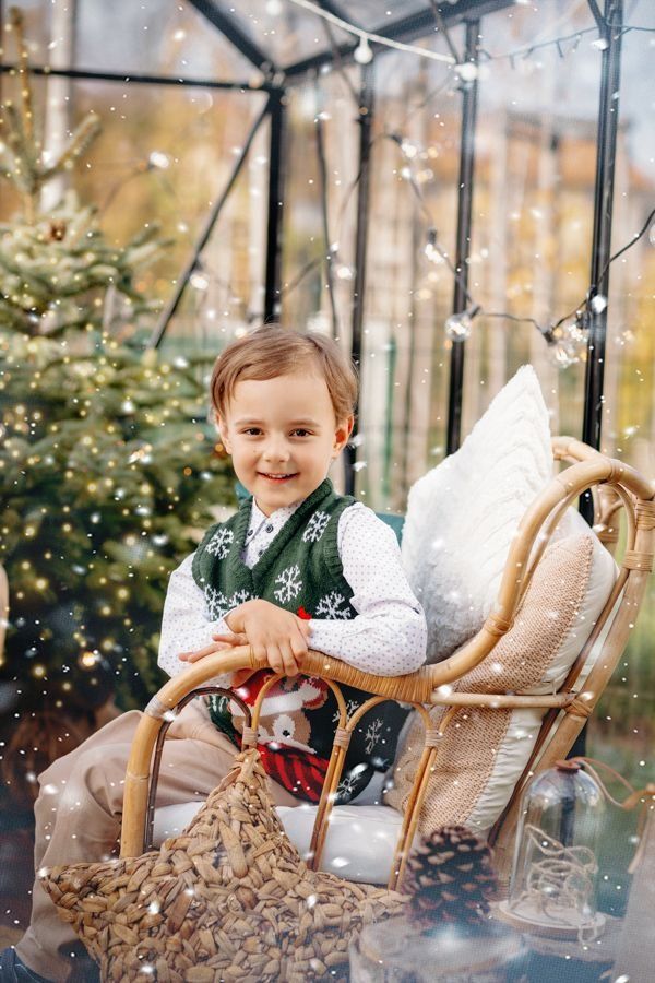 Series of festive winter photos with child sitting in a wooden chair surrounded by warm lights and holiday decor.