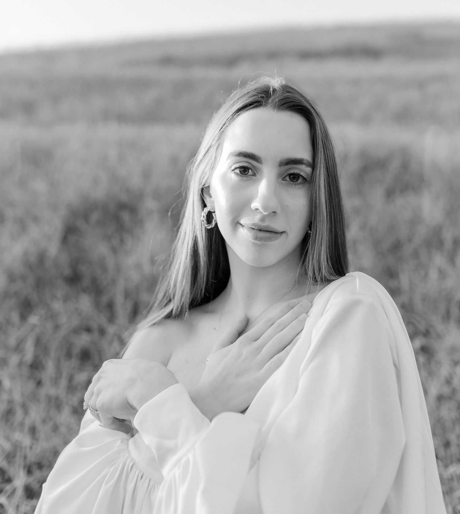 Classic black and white portrait in ethereal setting with soft natural light.