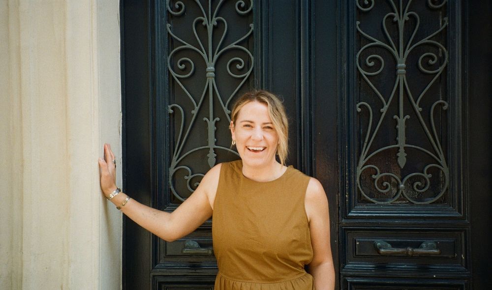 candid portrait photographer capturing movement and connection in a documentary style in Paris
