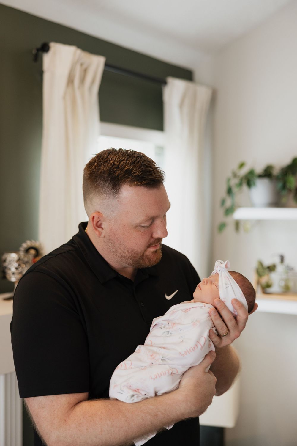 Dad and his newborn daughter photography at home in Avon, Ohio.