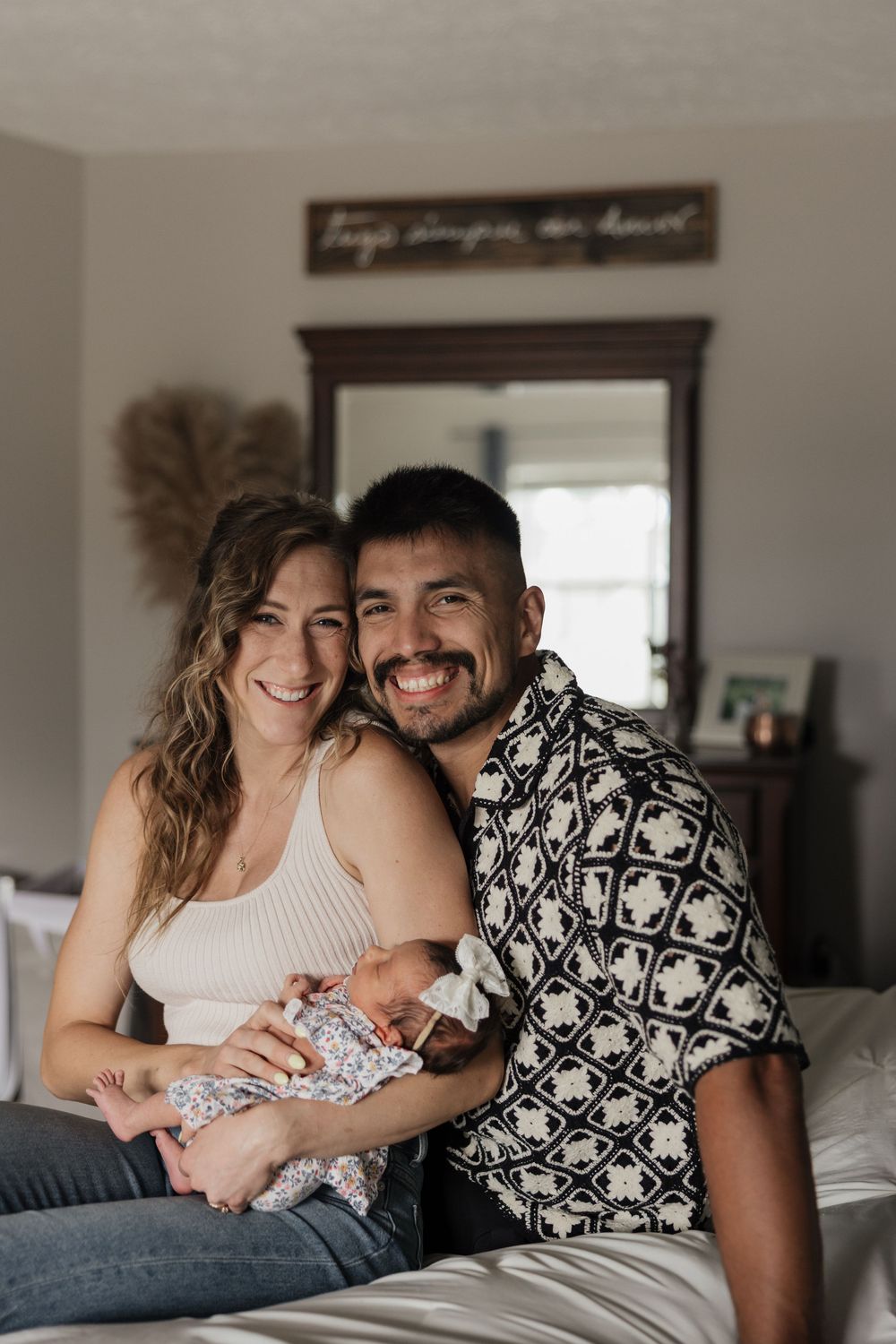 Biracial couple newborn photography at home with baby girl in Fairlawn and Copley, Ohio.