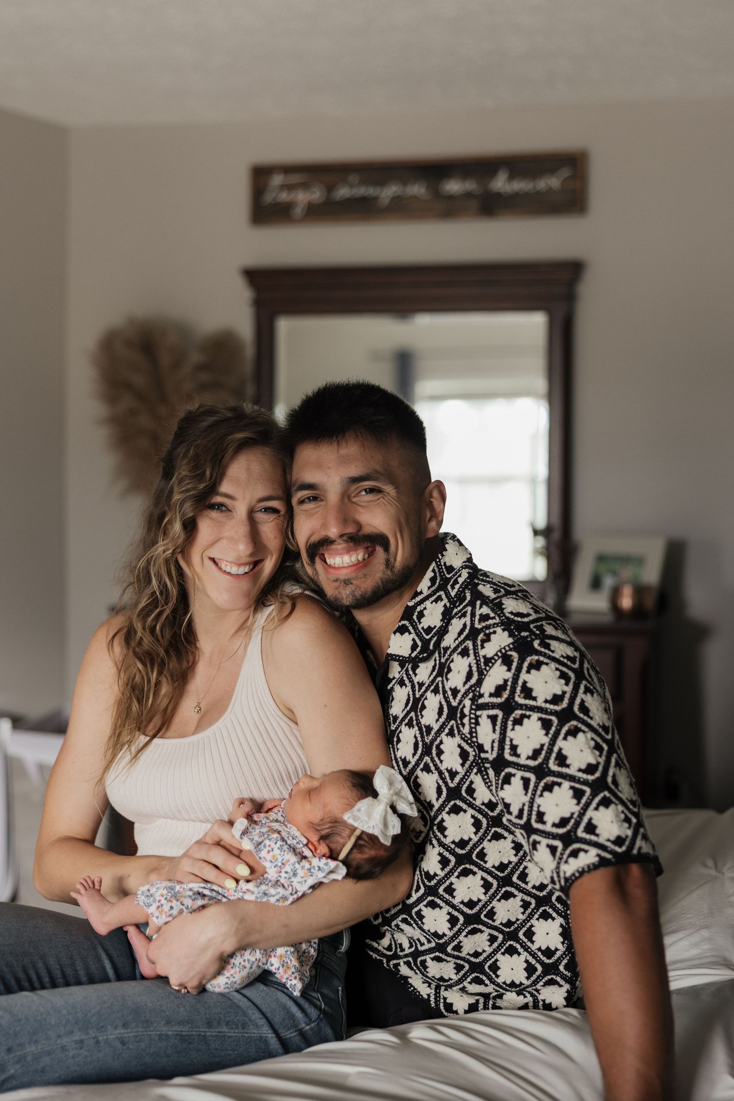 Biracial couple newborn photography at home with baby girl in Fairlawn and Copley, Ohio.
