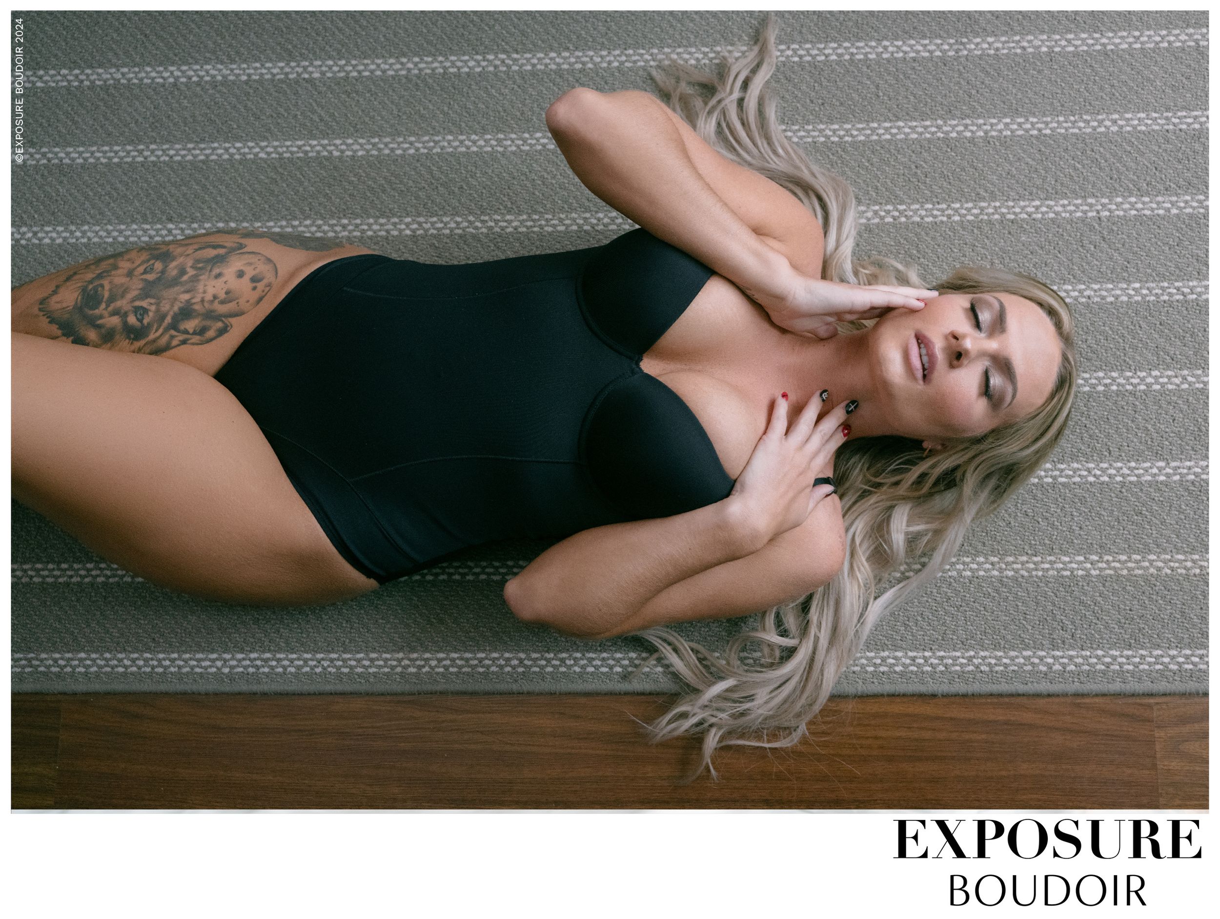 Artistic boudoir portrait on grey blanket with Exposure Boudoir branding visible at bottom.