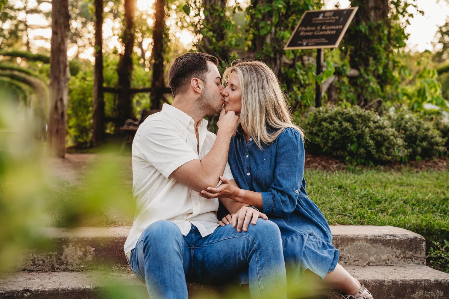 engagement session couple kissing at golden hour