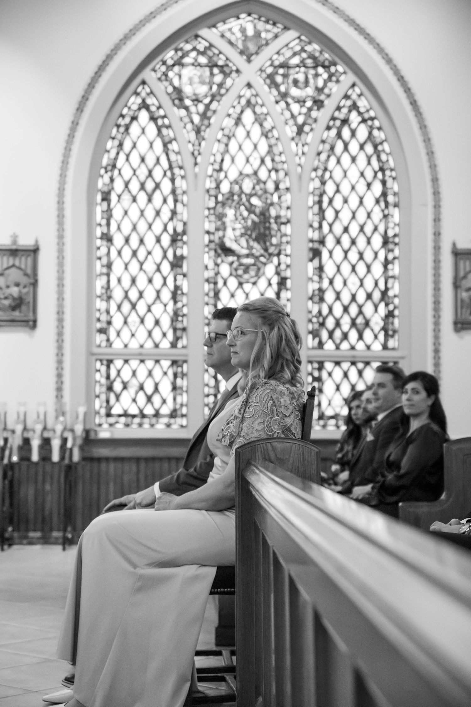 Black and white church interior photos with gothic arched windows and pews.