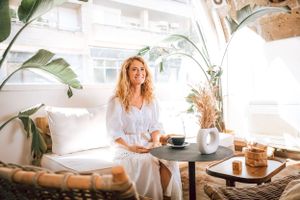 branding photoshoot of business woman enjoying coffee at Café Sāntal Palma de Mallorca.