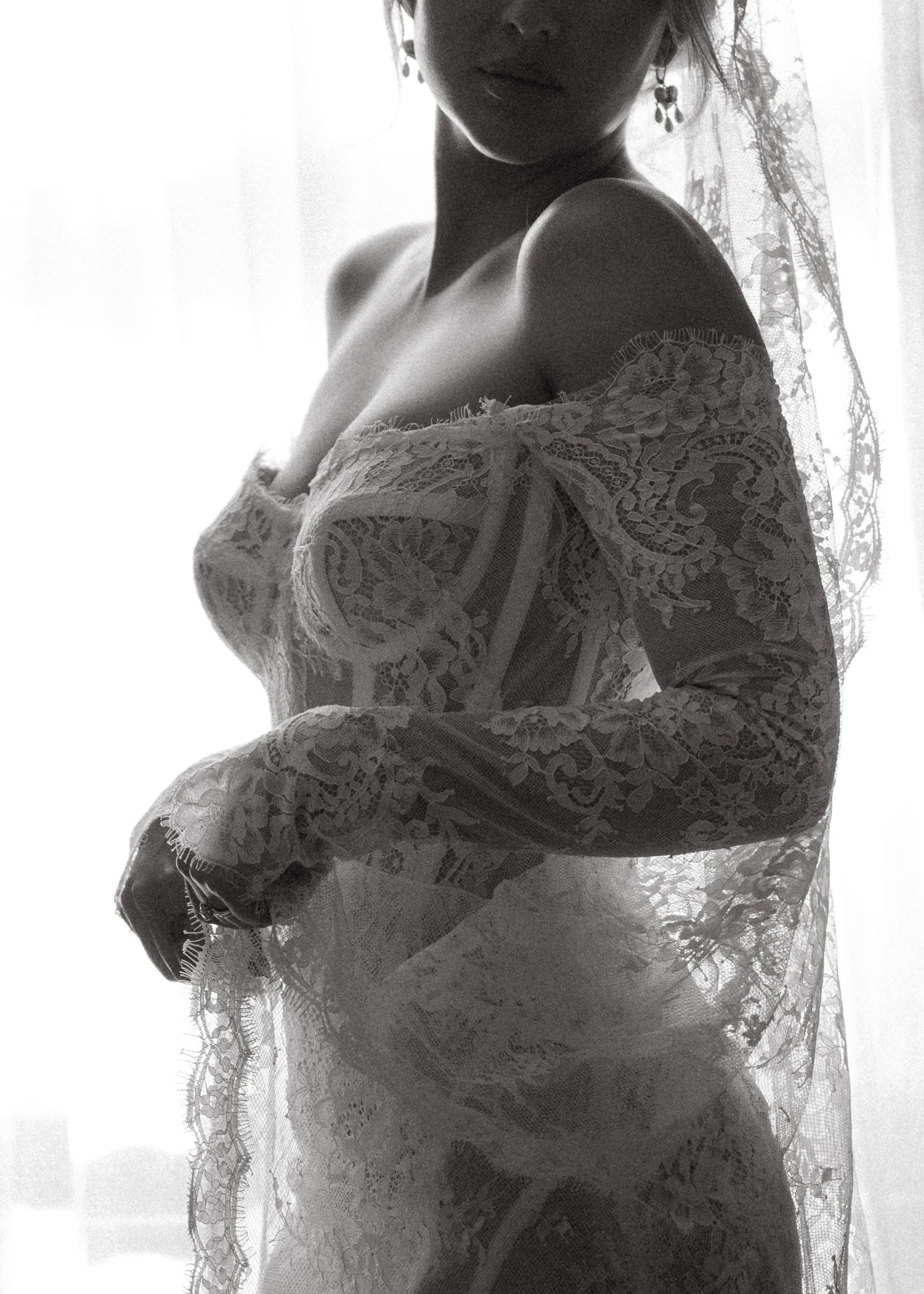 Close-up series showing the intricate lace details of a wedding dress.
