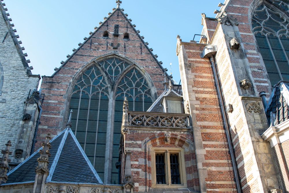 Medieval Gothic church architecture with pointed arches and intricate stonework in Amsterdam.