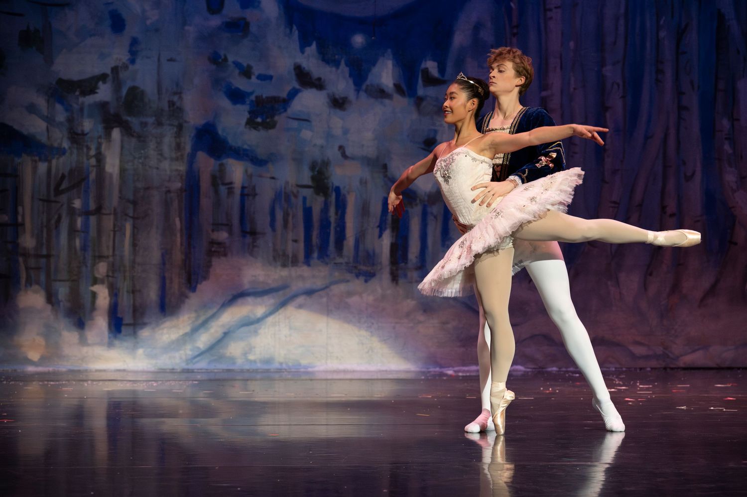 Nutcracker Snow Queen and Prince in ballet pose.