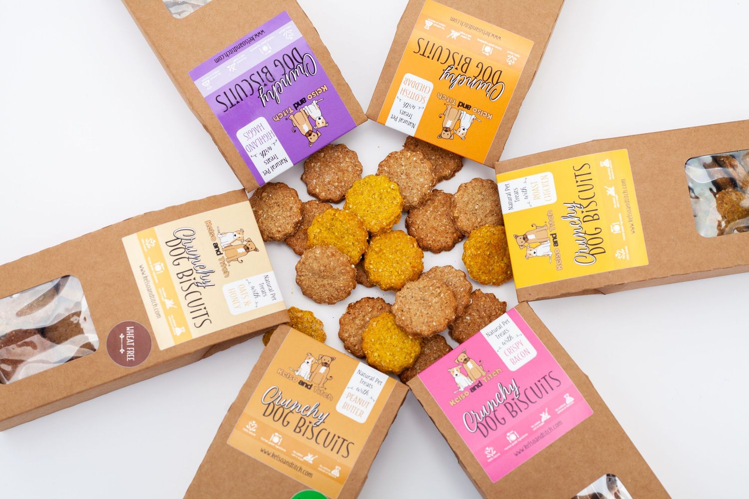 Various different dog biscuits and there packaging in a star layout.