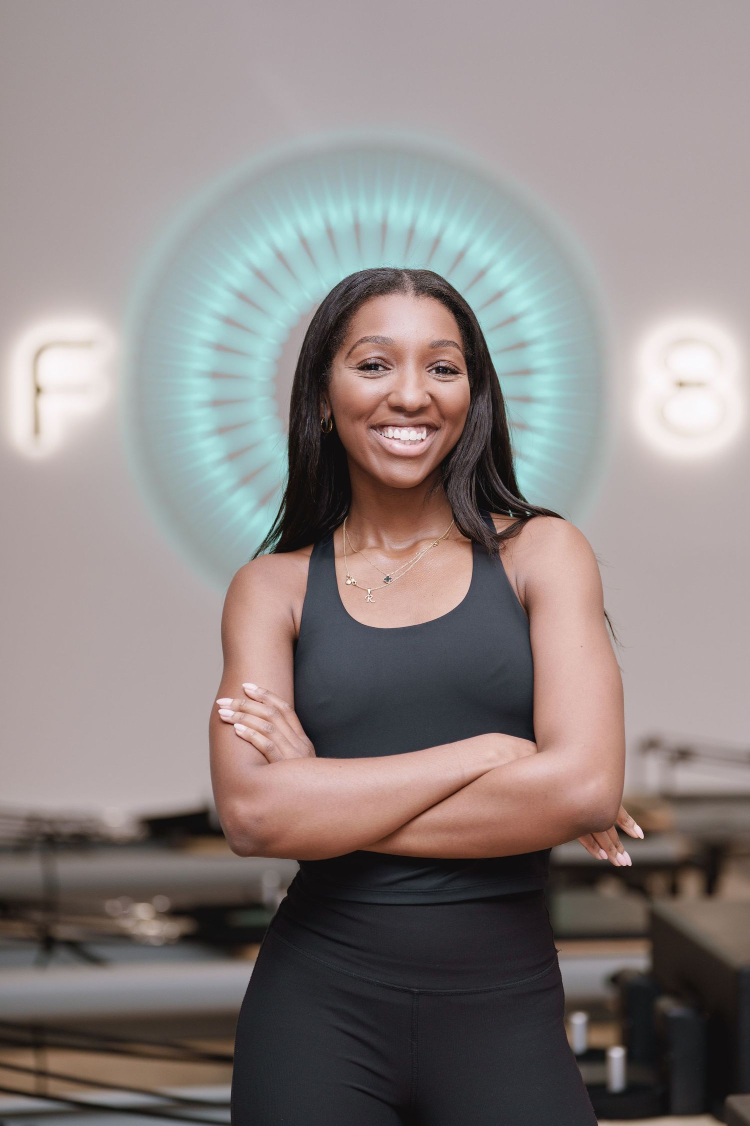 A reformer Pilates Coach at FS8 Chiswick, London during her headshot session