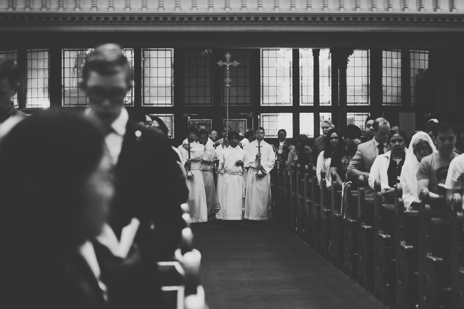 alter servers prepare to walk down to aisle towards the alter during mass at st andrew's cathedral in victoria, bc.