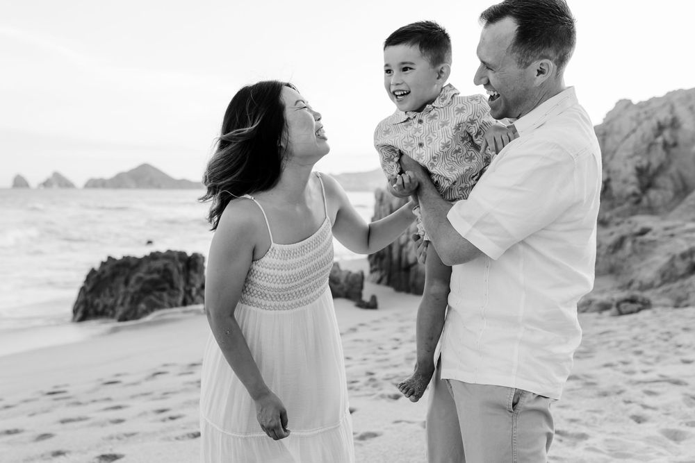 Smiling family during outdoor photoshoot in Cabo