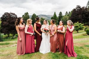 Bride and bridesmaids group shot at Atholl palace pitlochry with highland Perthshire as the backdrop.