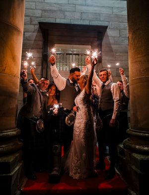 Wedding couple sparkler exit on steps at Balbirnie House Fife with bridal party