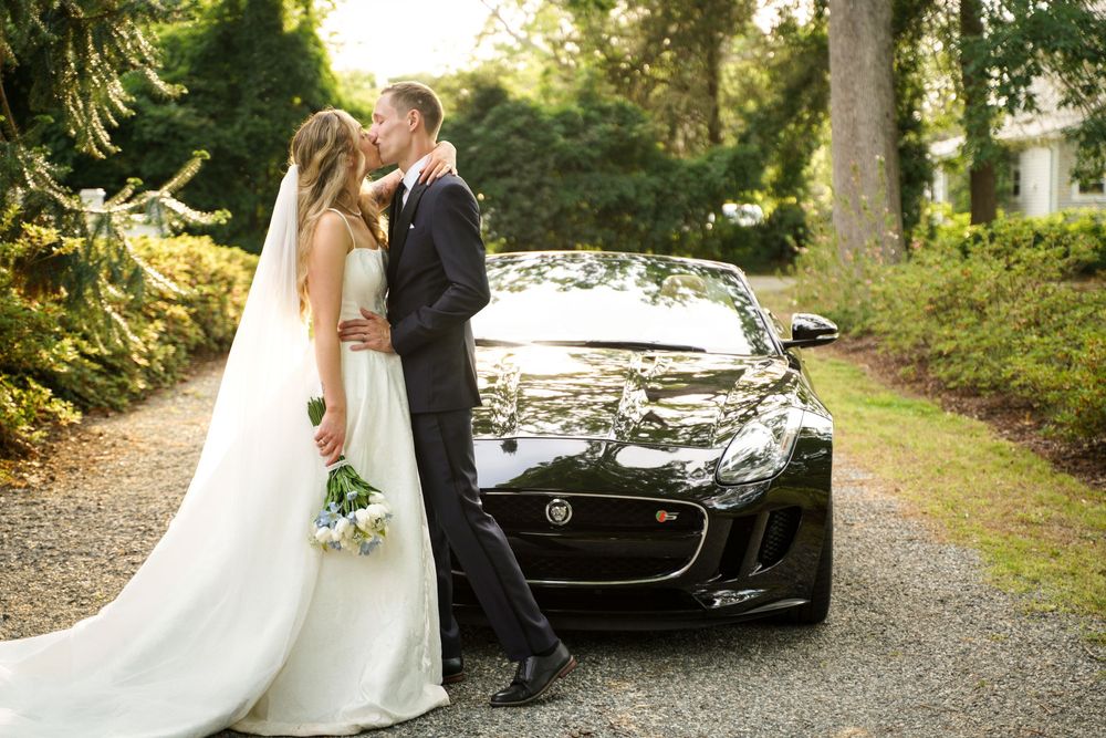 bride and groom with Jaguar