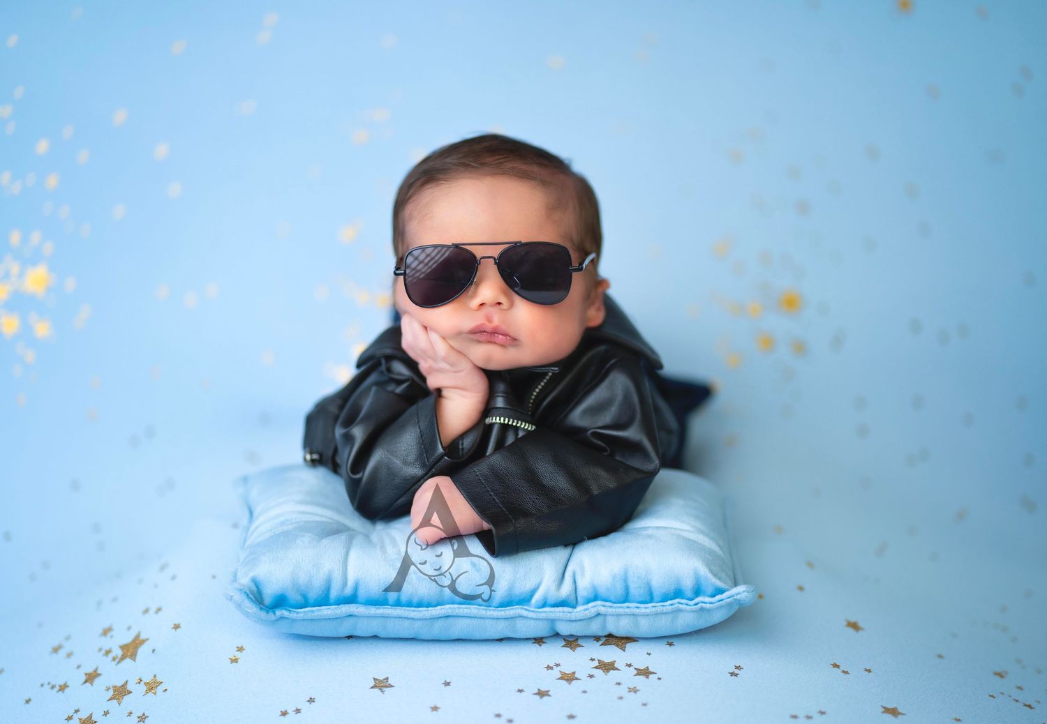 Cool photography setup with sunglasses against blue background.