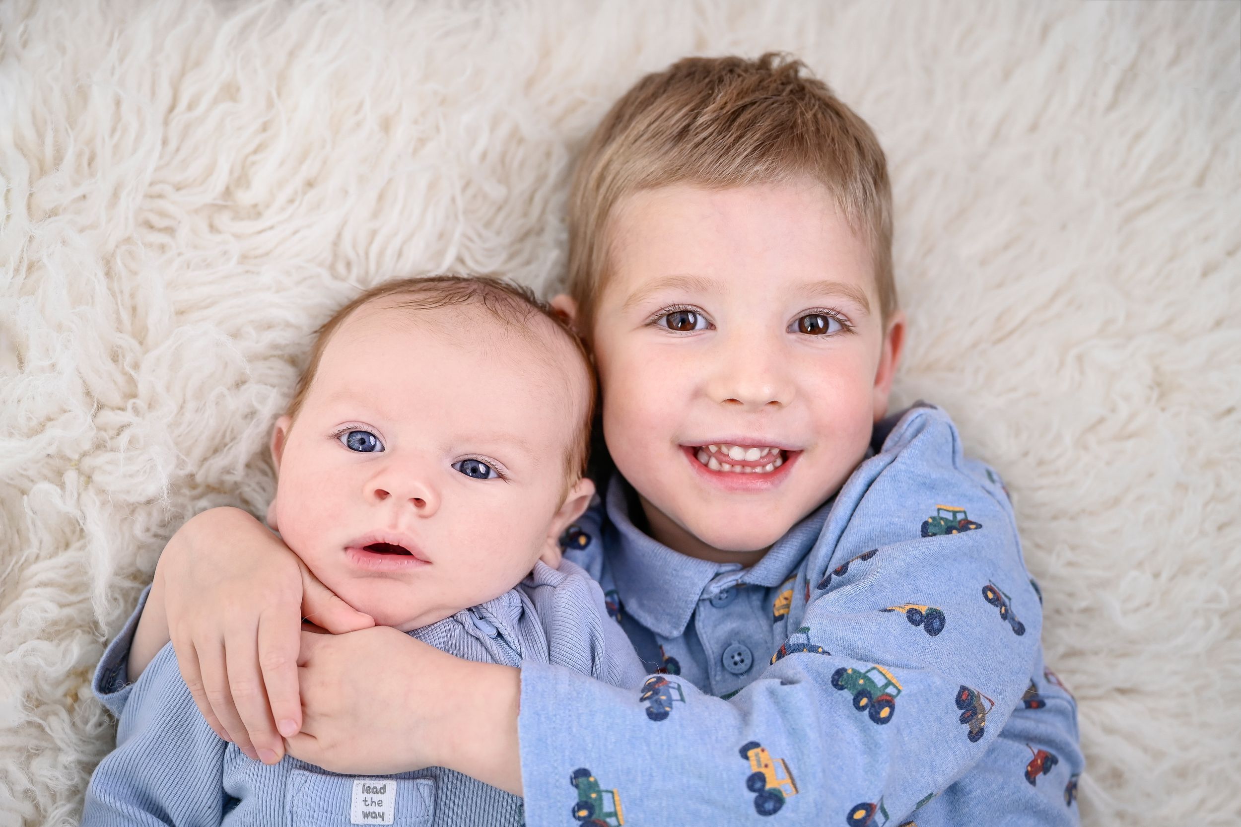 newborn photography studio ashford kent sibling photo in matching blue tones