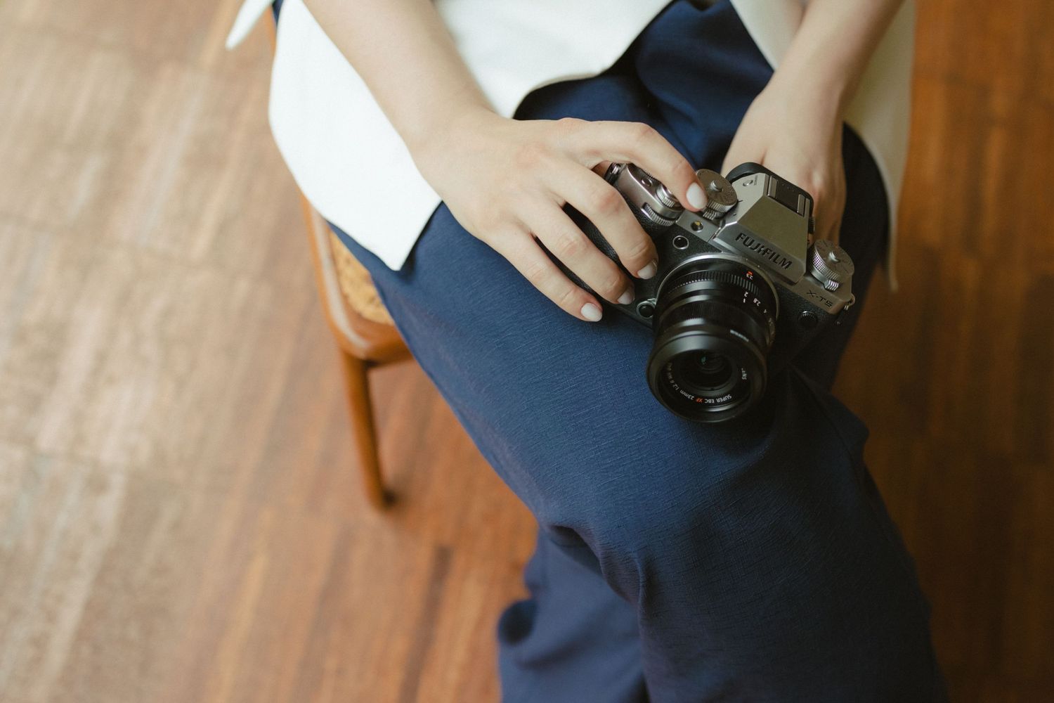 camera vintage but tech, wood chair and wood floor