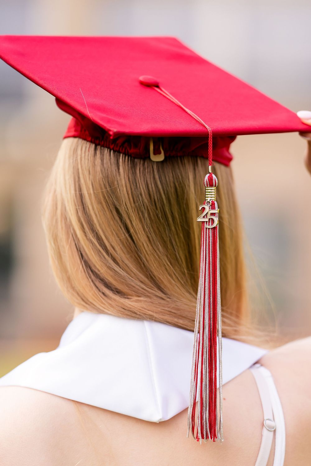 A close up of the back of a girl wearing a graduation cap so you can see the tassel  taken by Milwaukee senior photographer Rachel Dickman.