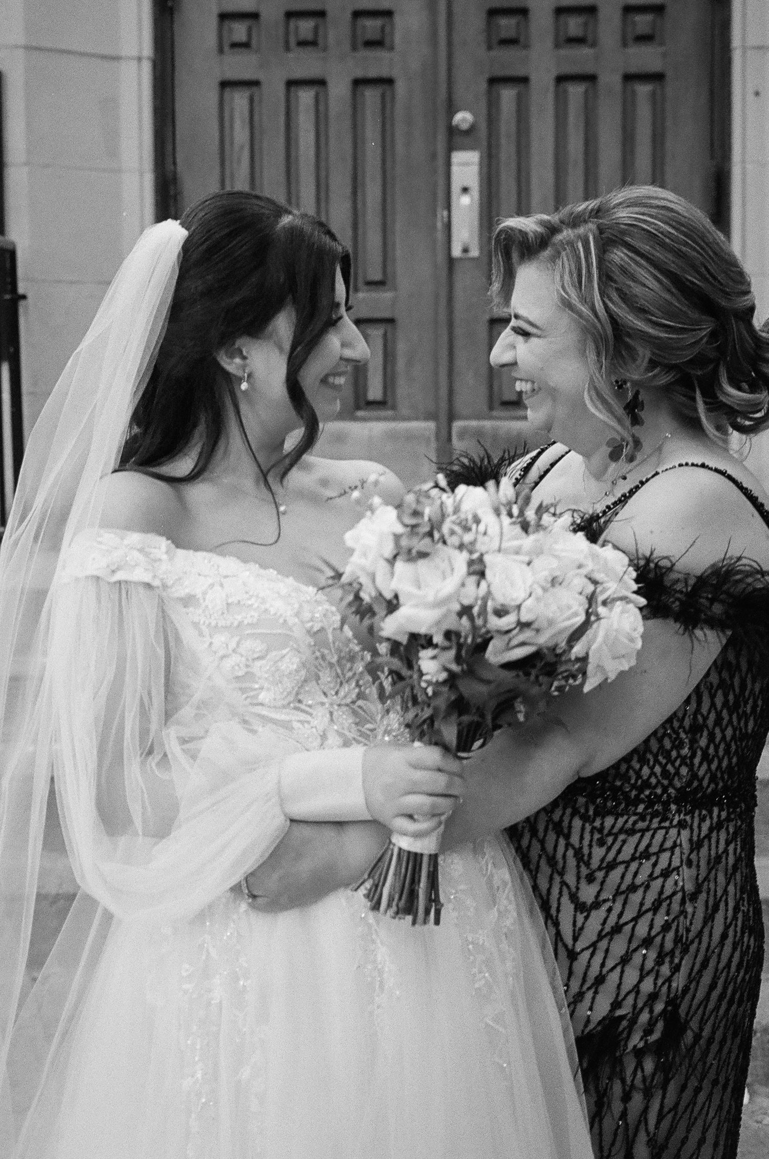 A tender moment between a bride in white lace and her loved one captured in a series of black and white photographs.