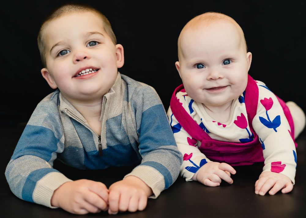 Sibling Daycare photo day moment with unposed expression