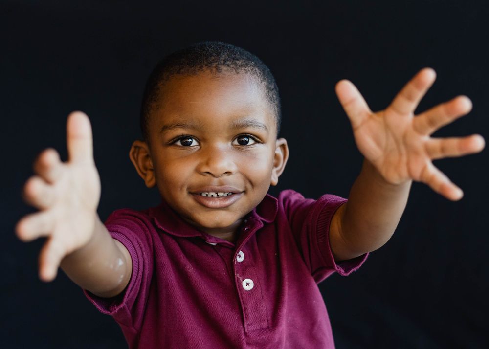 Young child photographed during calm and playful moment at school
