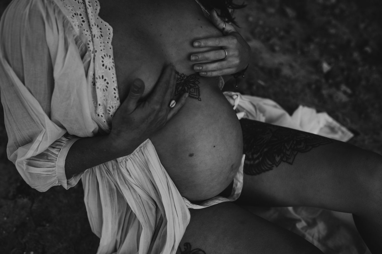 Black and white maternity photography capturing intimate moments.