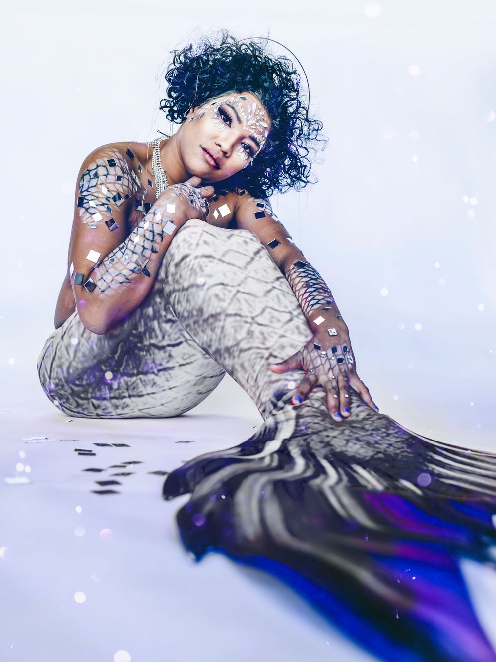 Shiny purple mermaid on a white background, showcasing a vibrant and magical look.