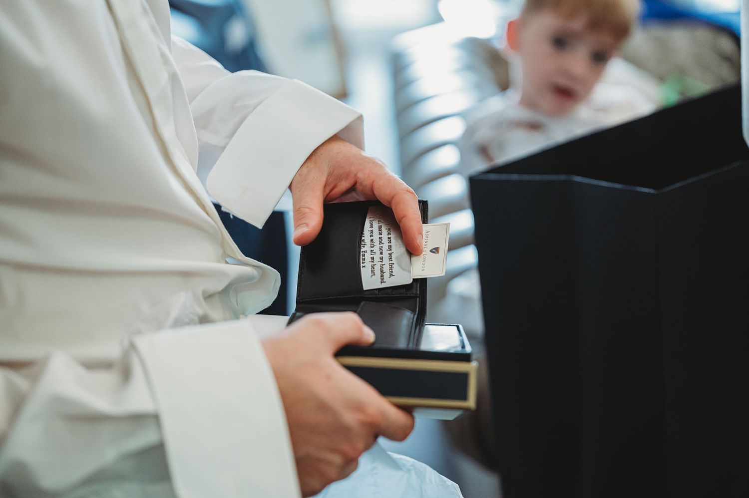 Medical professional holding a credit card and electronic payment device for healthcare transaction.