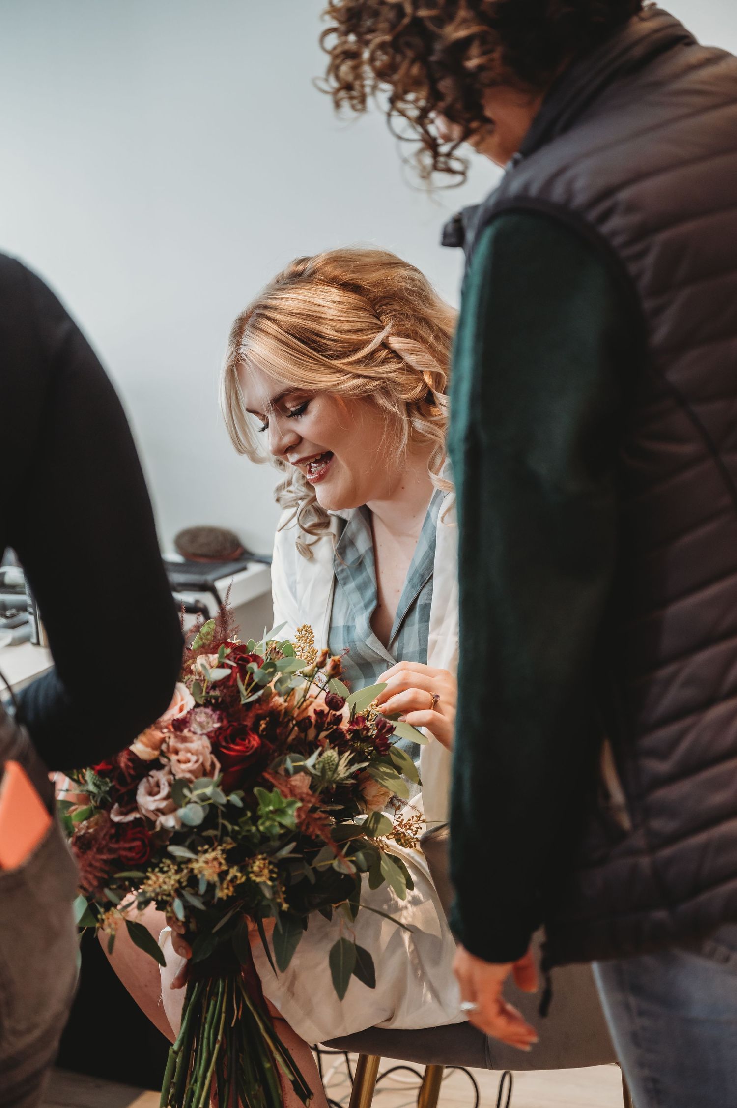 Preparation moment with wedding flowers and styling details.