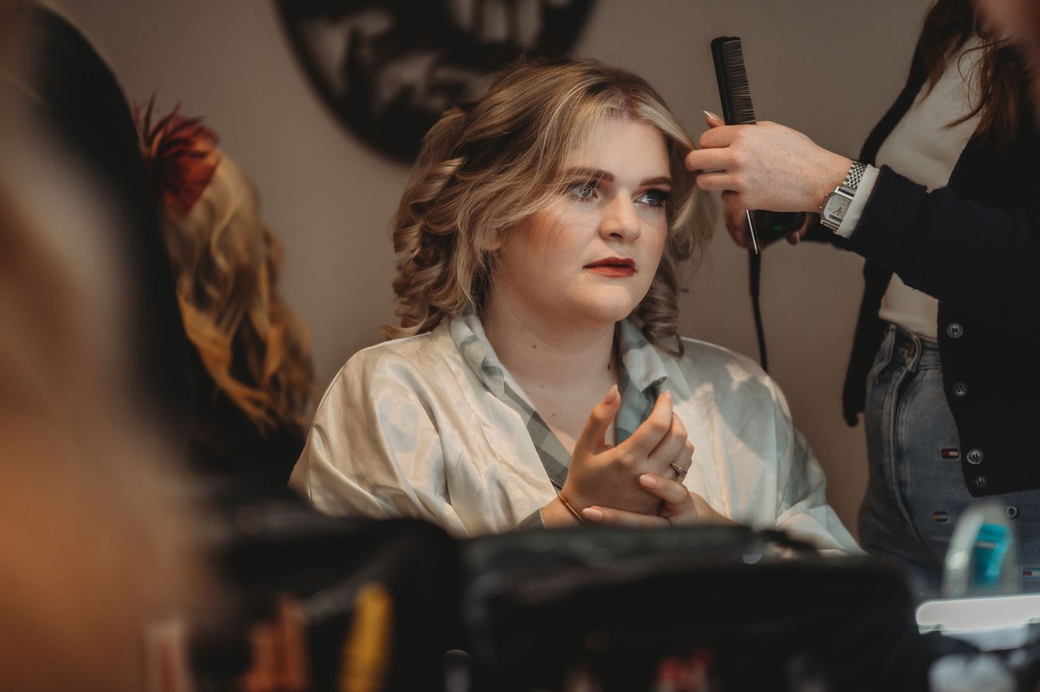 Getting ready scene with styling tools and preparations in progress.