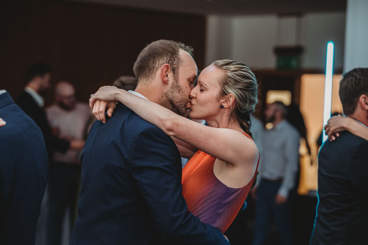 Couple sharing a passionate dance embrace during their wedding reception.