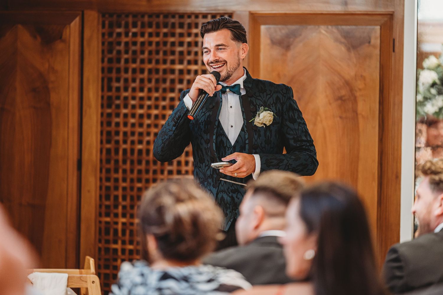 A wedding speaker gives an emotional speech during the reception dinner.