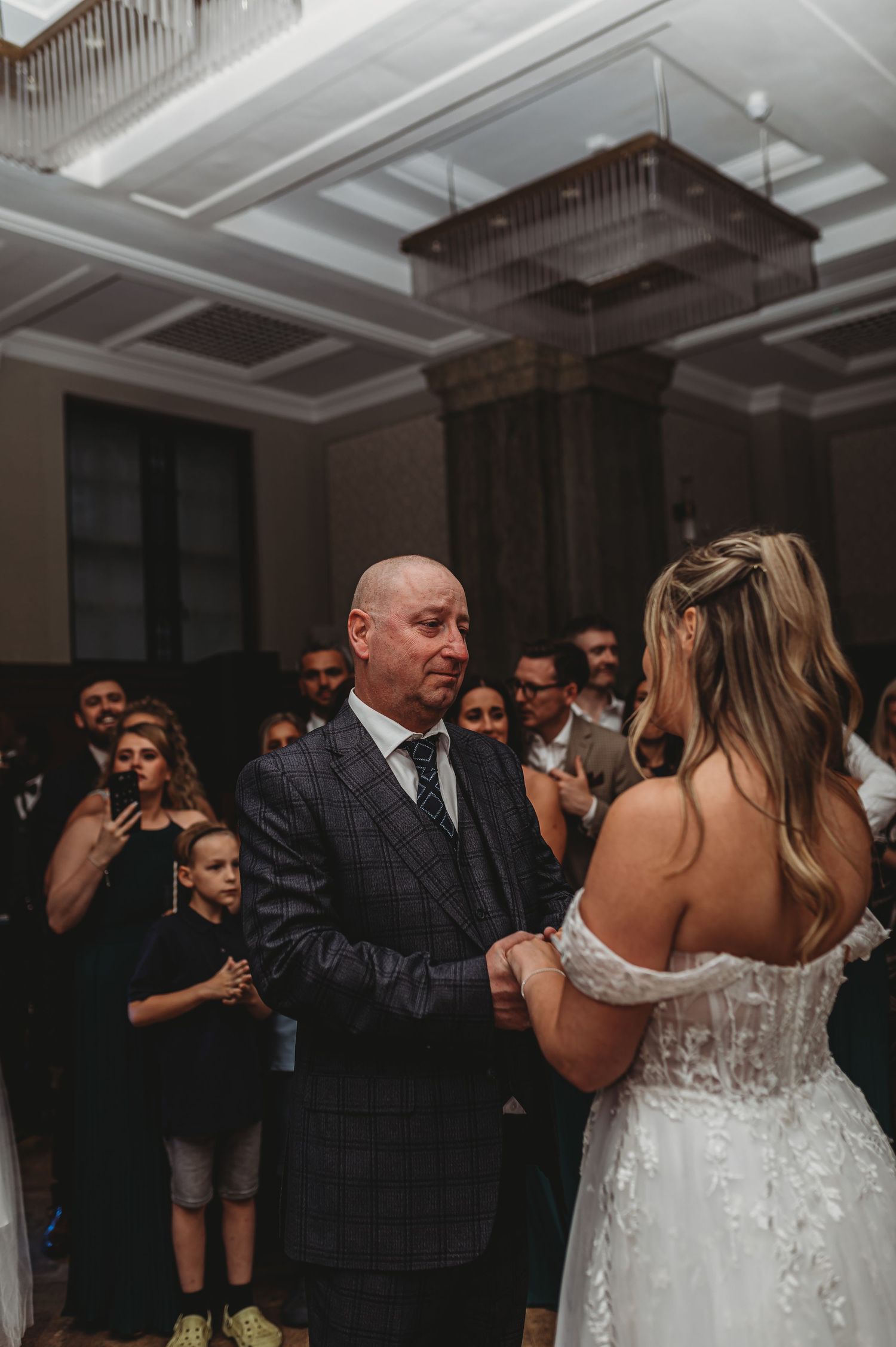 An emotional dance moment captured during a wedding reception.