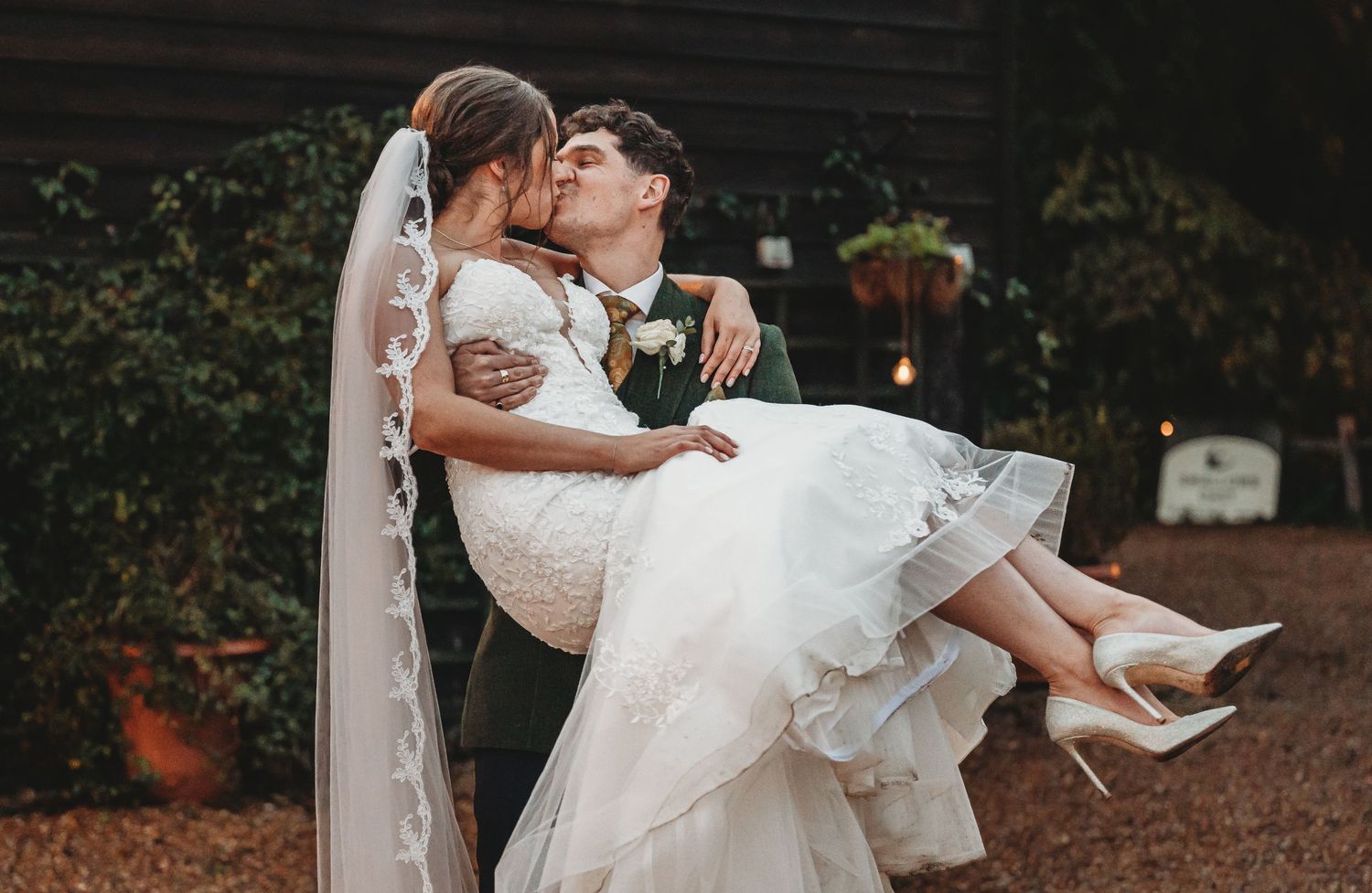 A romantic moment shared between two people during a wedding celebration.