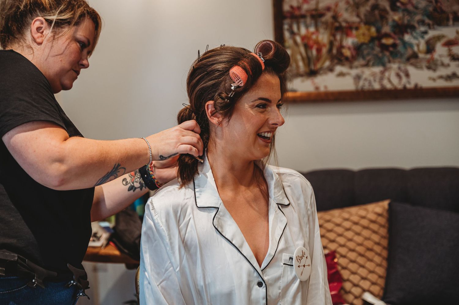 A pre-wedding preparation scene with hair styling in progress.