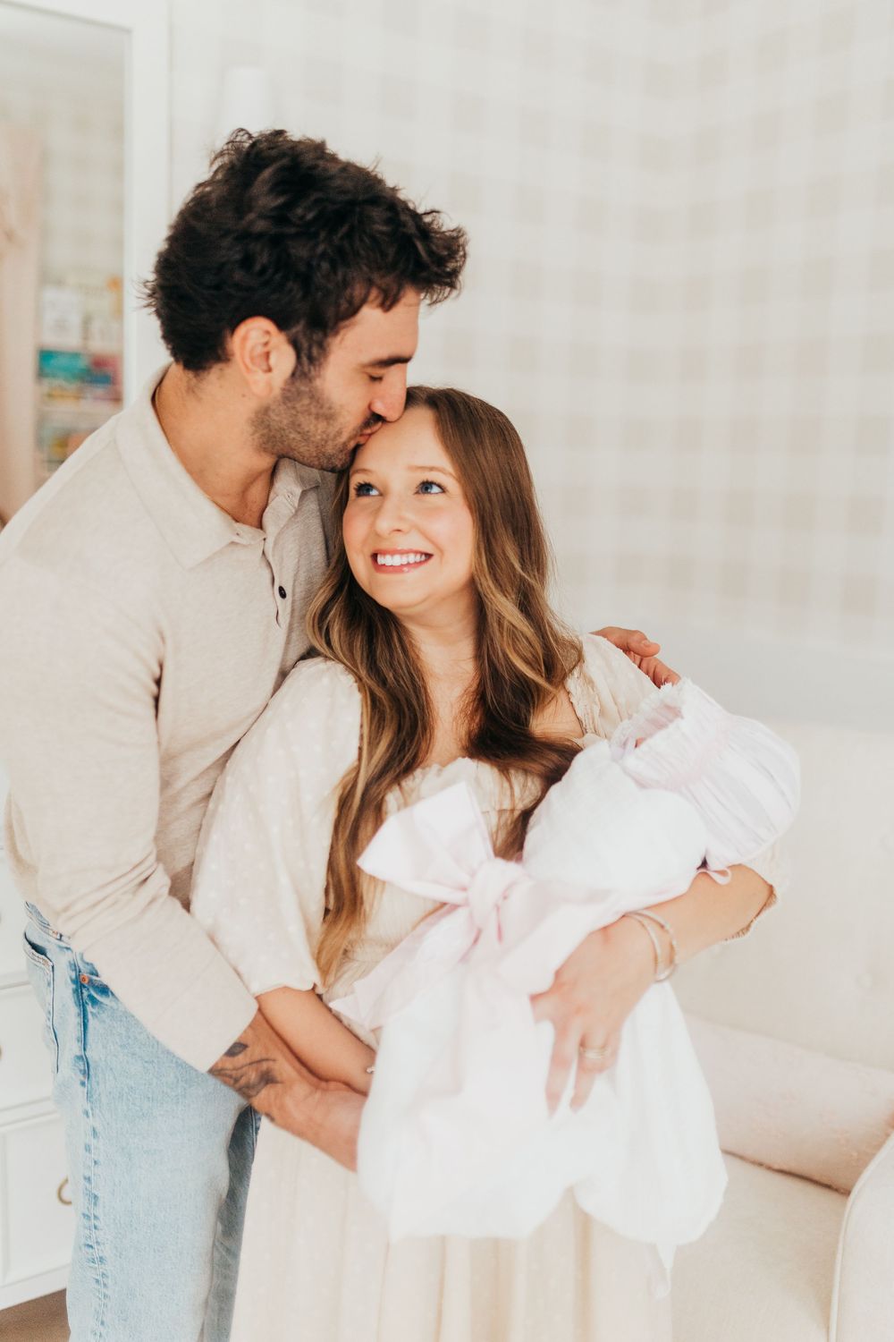 A couple in casual attire sharing intimate moments in a bright indoor setting, captured in a three-part photo series.