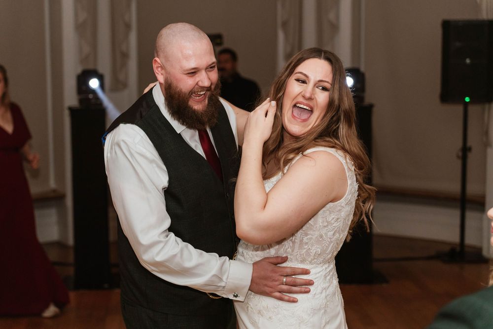 Eastington Park wedding photography Gloucestershire Evening Reception couple laughing on dancefloor bride and groom