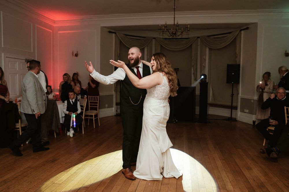 Eastington Park wedding photography Gloucestershire Evening Reception couple beckoning guests onto dancefloor