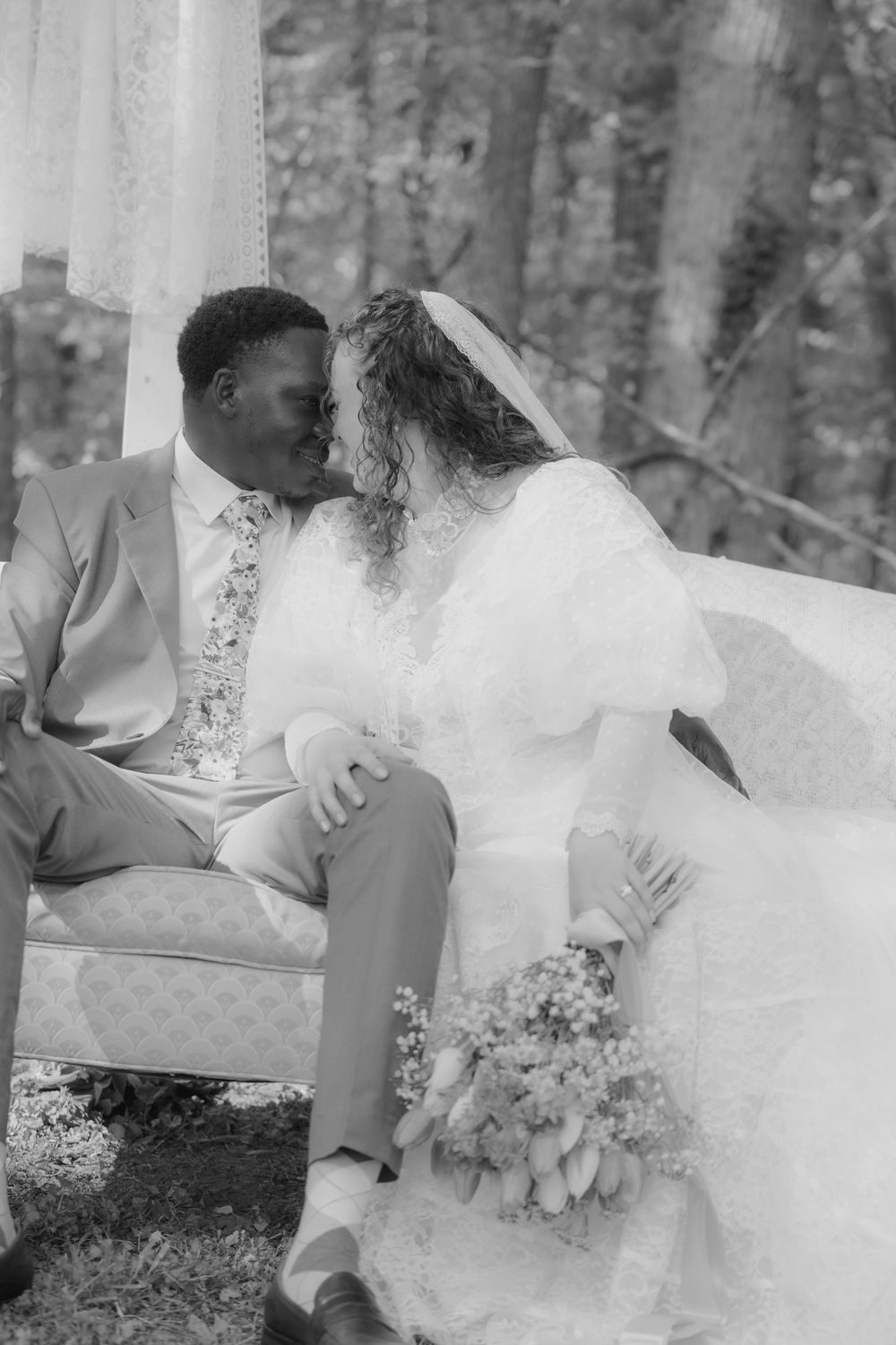 A series of romantic black and white wedding photos showing tender moments between newlyweds outdoors.